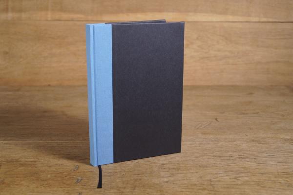 notizbuch schwarz hellblau leinen